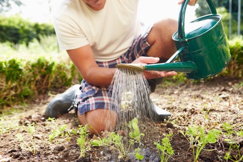 Professional synthetic turf fitting process in a local Morden rear garden